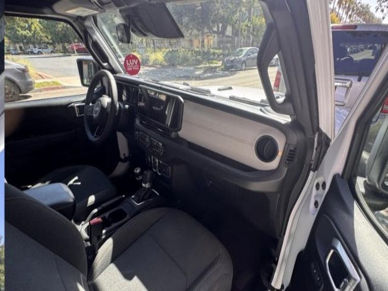 Front seats and console through the open passenger door