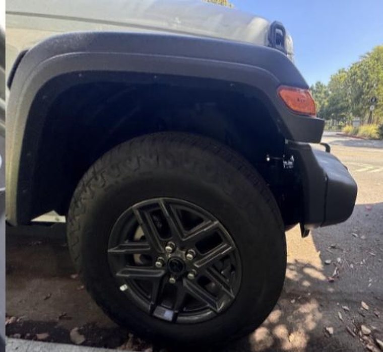 Front wheel and tire, tread visible